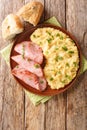 Pease PuddingÃÂ is an easy, British side dish traditionally serve with ham closeup in the plate. Vertical top view Royalty Free Stock Photo